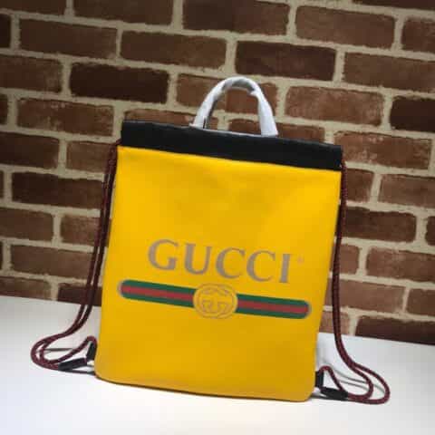 GUCCI古驰黄色柔软皮革抽绳背包523586